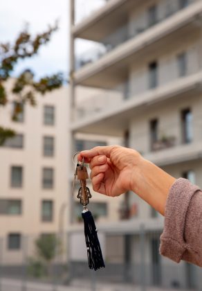 hand-holding-keys-outdoors